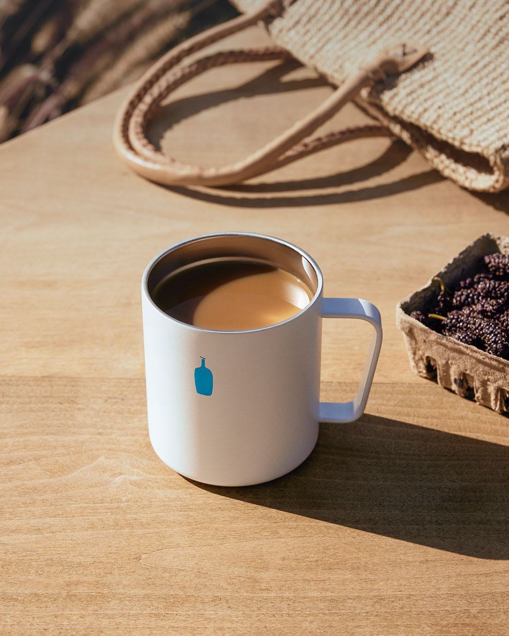 MiiR 12Ounce Commuter Mug on table outside